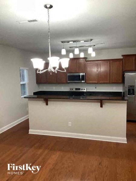 a kitchen with a counter top and a microwave
