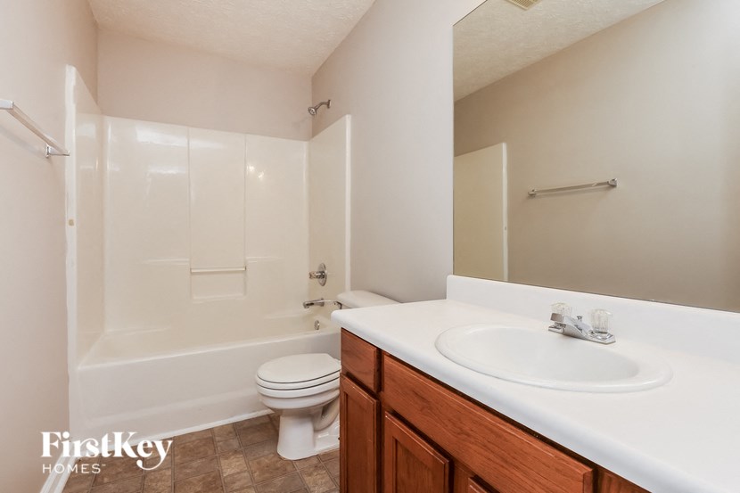 a bathroom with a sink toilet and a shower