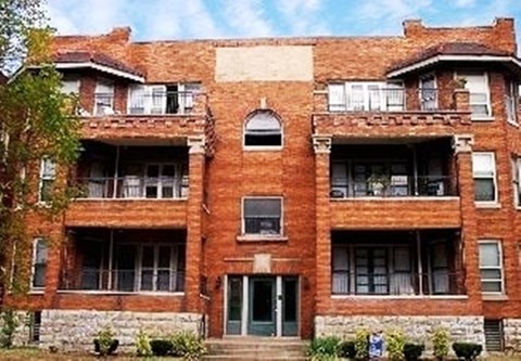 a red brick building with windows and
