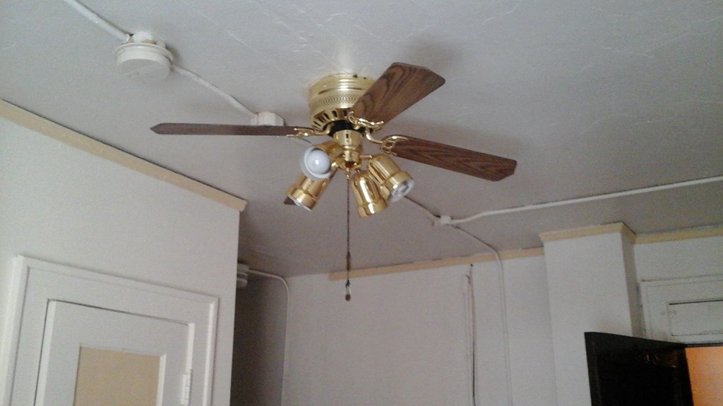 a ceiling fan hanging from the ceiling of a room
