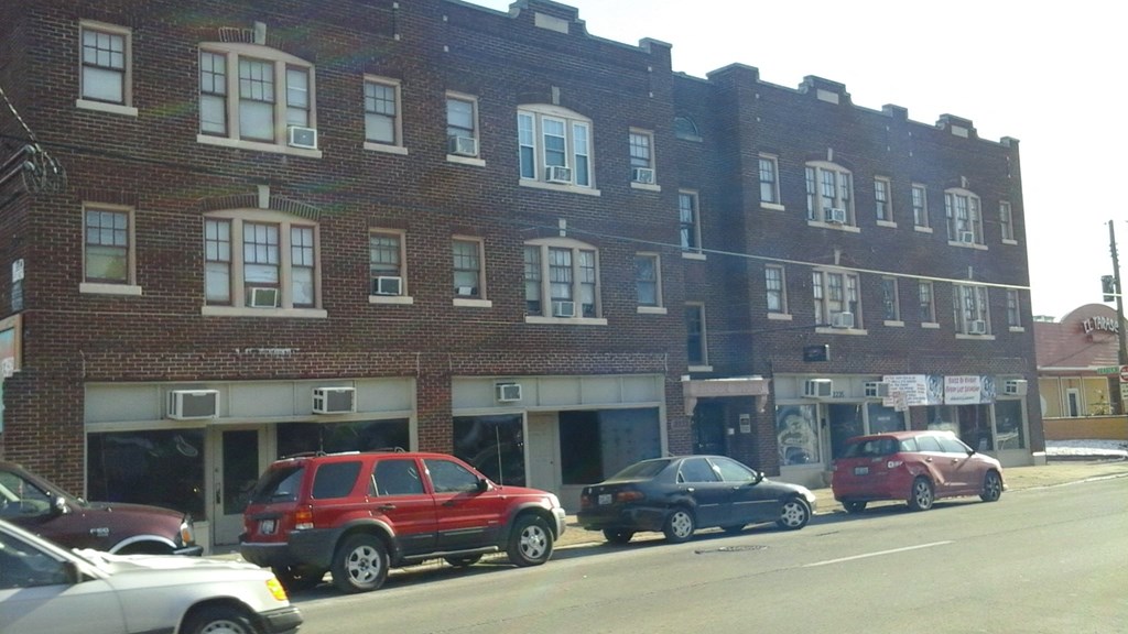 an old brick building on a city street