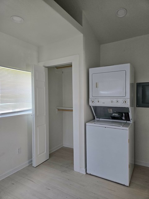 A white oven and microwave in a kitchen.