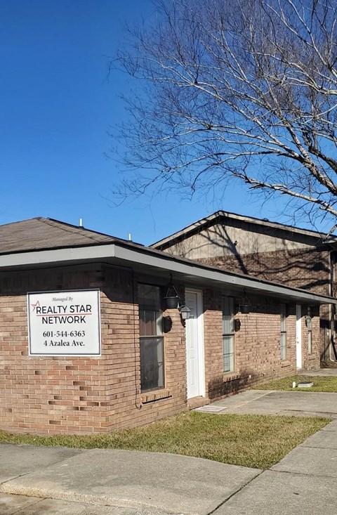 A building with a sign that says "DEALTY STAR NETWORK" on it.