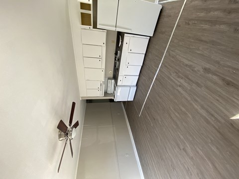 a view from the top of a room looking down into the floor of a kitchen