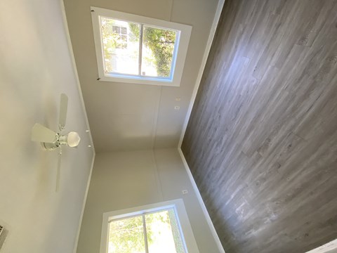 the view from the top of the ceiling looking down into the hallway of a home