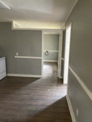 A room with a white door and a window.
