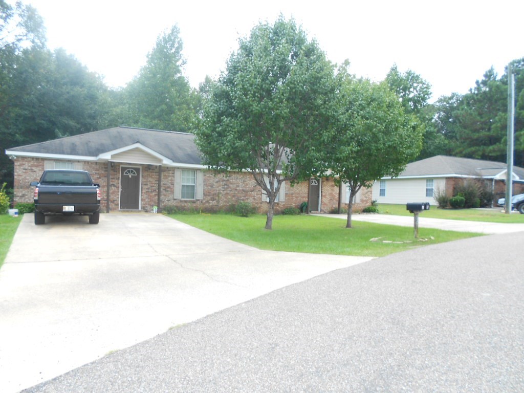 a house with a truck parked in the driveway