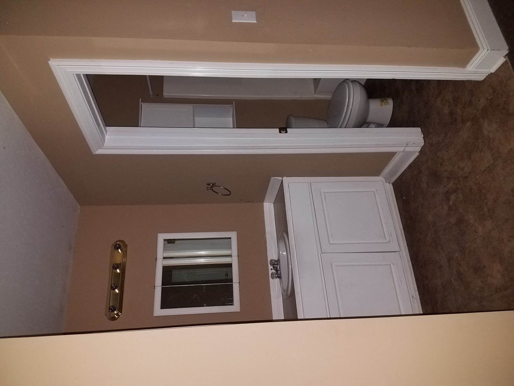 the view from the top of the stairs looking into the living room