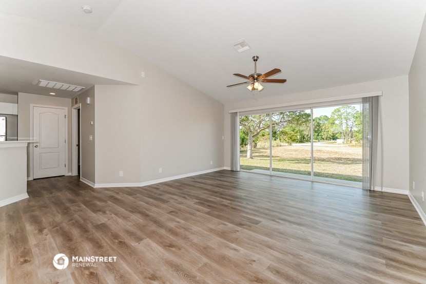 the living room and dining room are spacious and open to the backyard