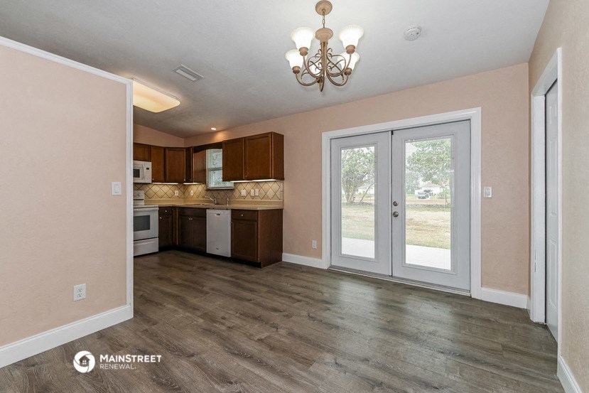 the kitchen is open to the dining room and living room