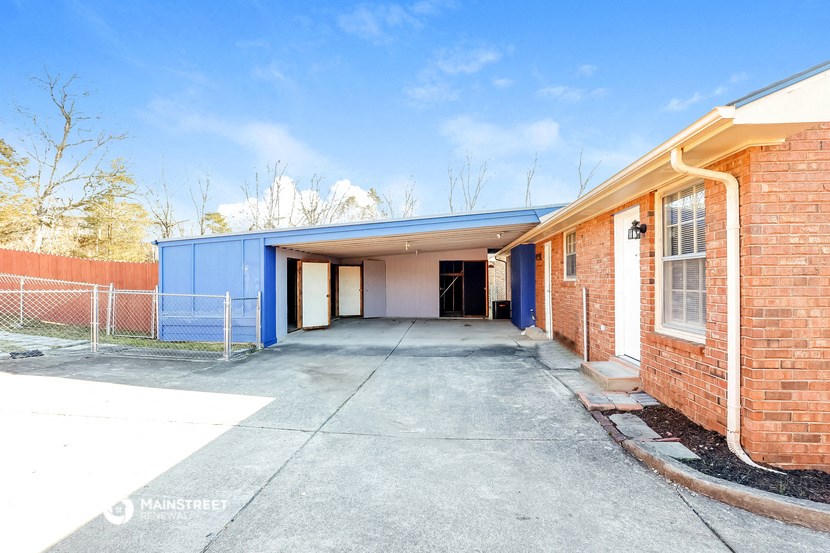 a large garage with a blue building on the side of it