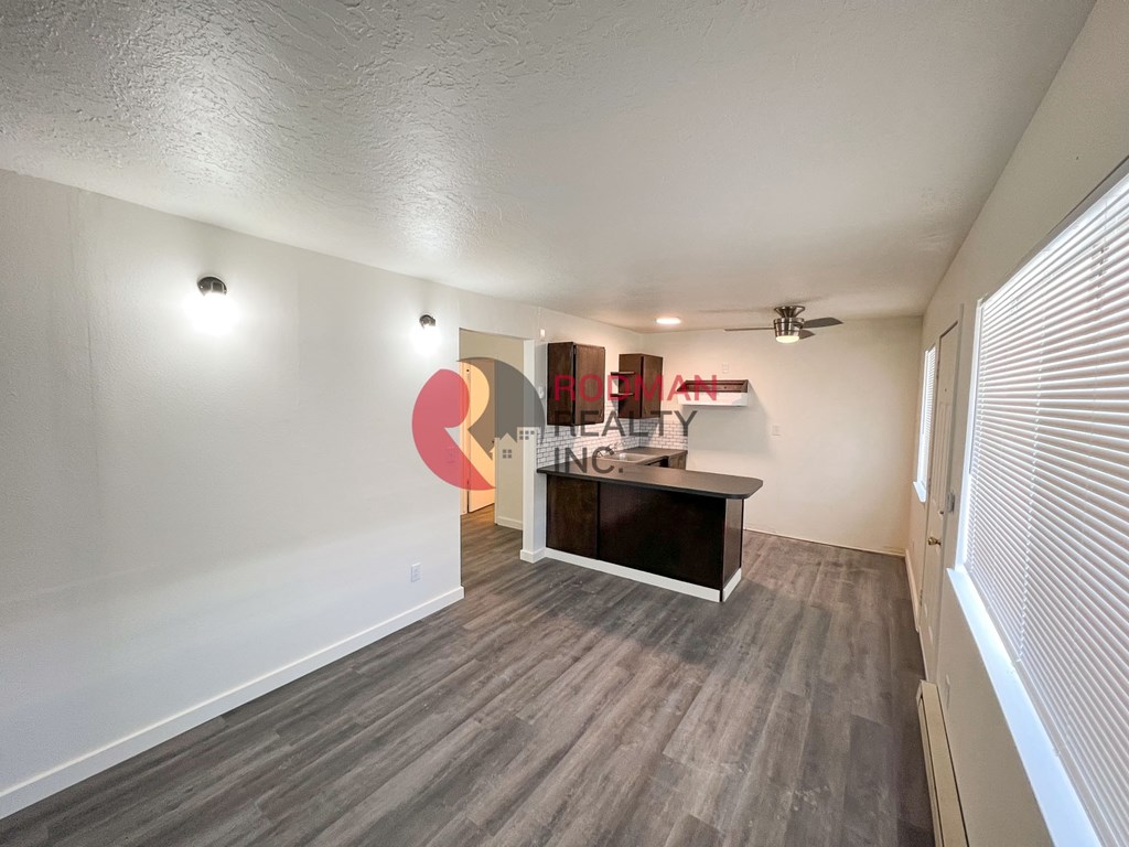 A room with a reception desk and a wall with a sign that says "HEALTH INSURANCE".