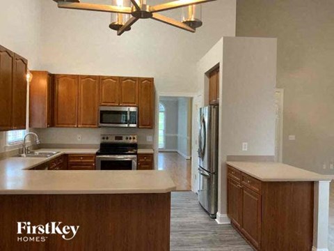 a kitchen with wooden cabinets