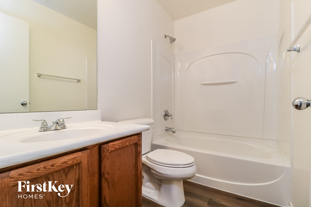 a bathroom with a sink toilet and a shower