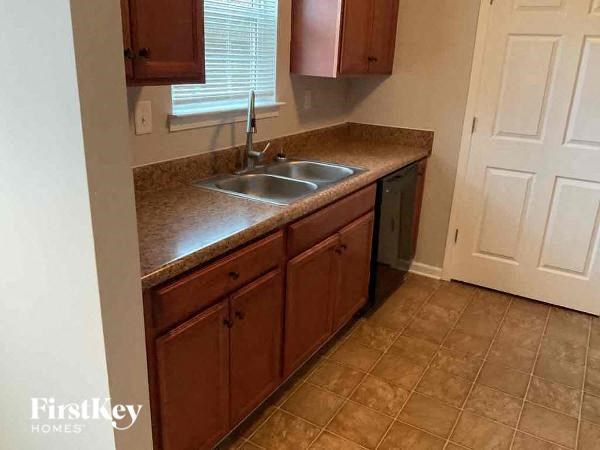 a kitchen with a sink and a counter top