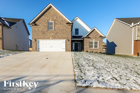 A house with a garage is shown in the image.