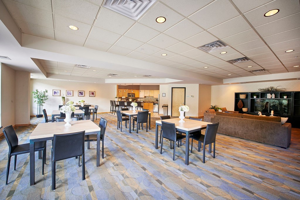 A dining area with tables and chairs.
