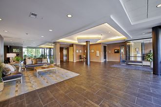 a large lobby with a couch and a table