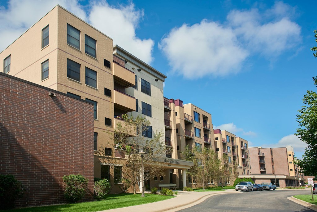 Apartment buildings with a clear blue sky above them.