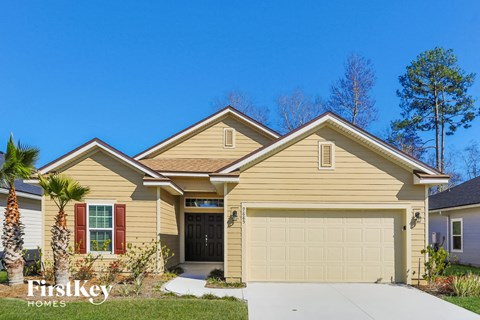a tan house with a garage door