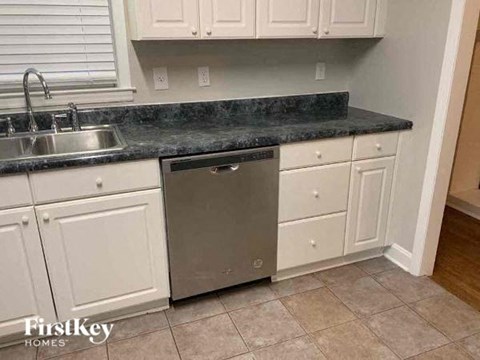 A kitchen with a dishwasher and a sink.