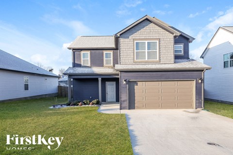 A two-story house with a garage is for sale by FirstKey Homes.