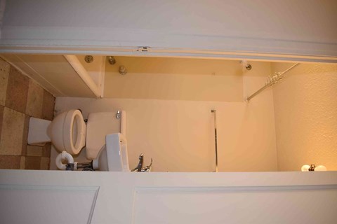 a bathroom with a toilet and a sink