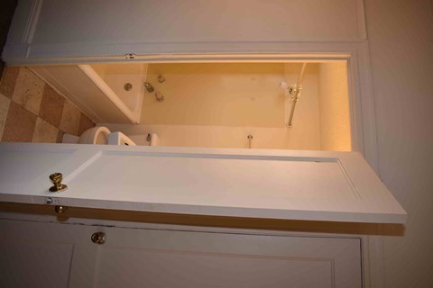 a bath room with a sink and a mirror