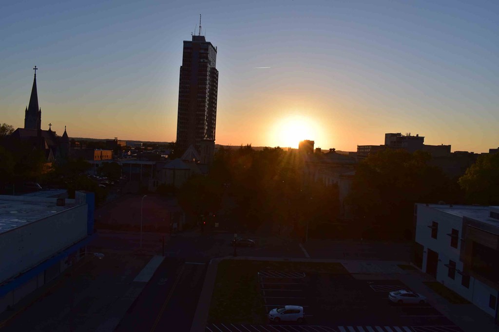 the tallest building at sunset in the city