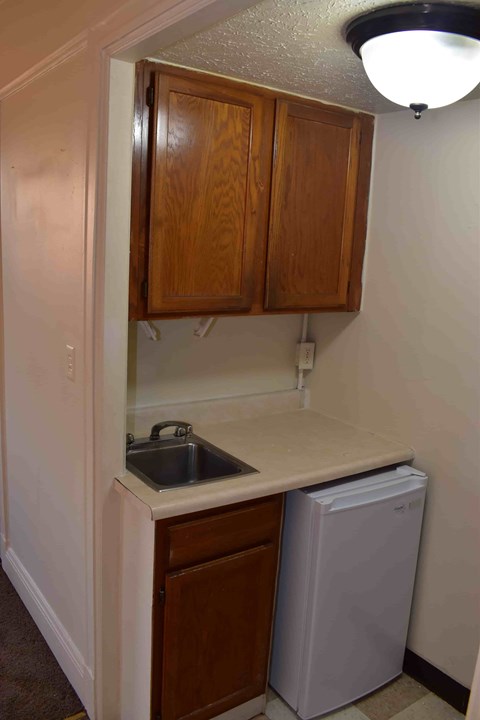 A small kitchen with a sink and a dishwasher.