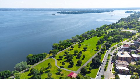 A large body of water with a landmass on the other side.
