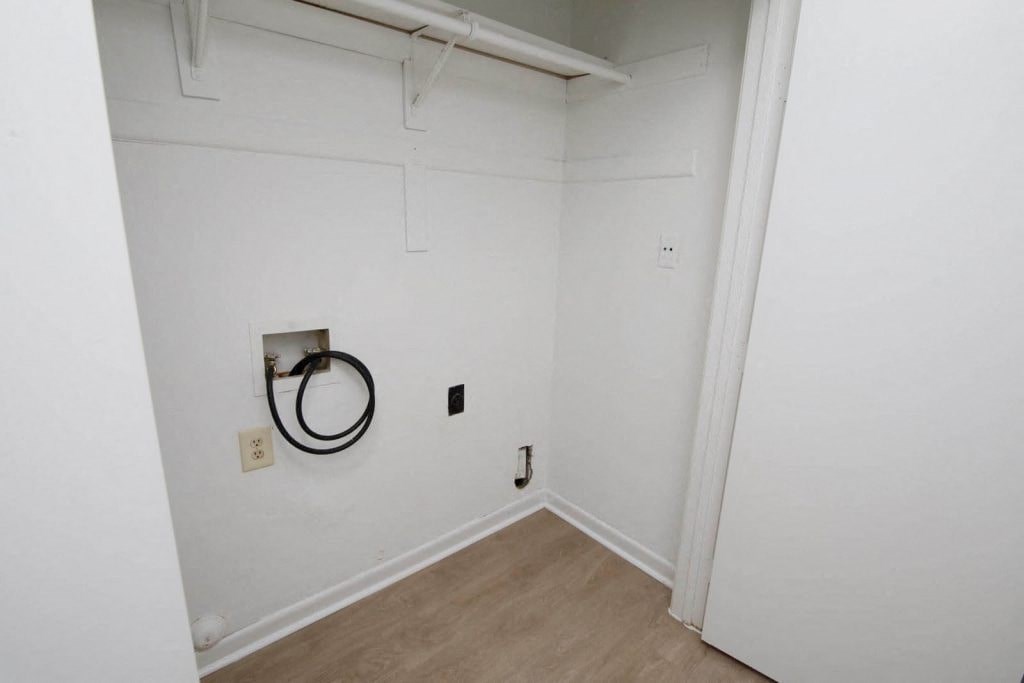 a white room with a white wall and a white door
