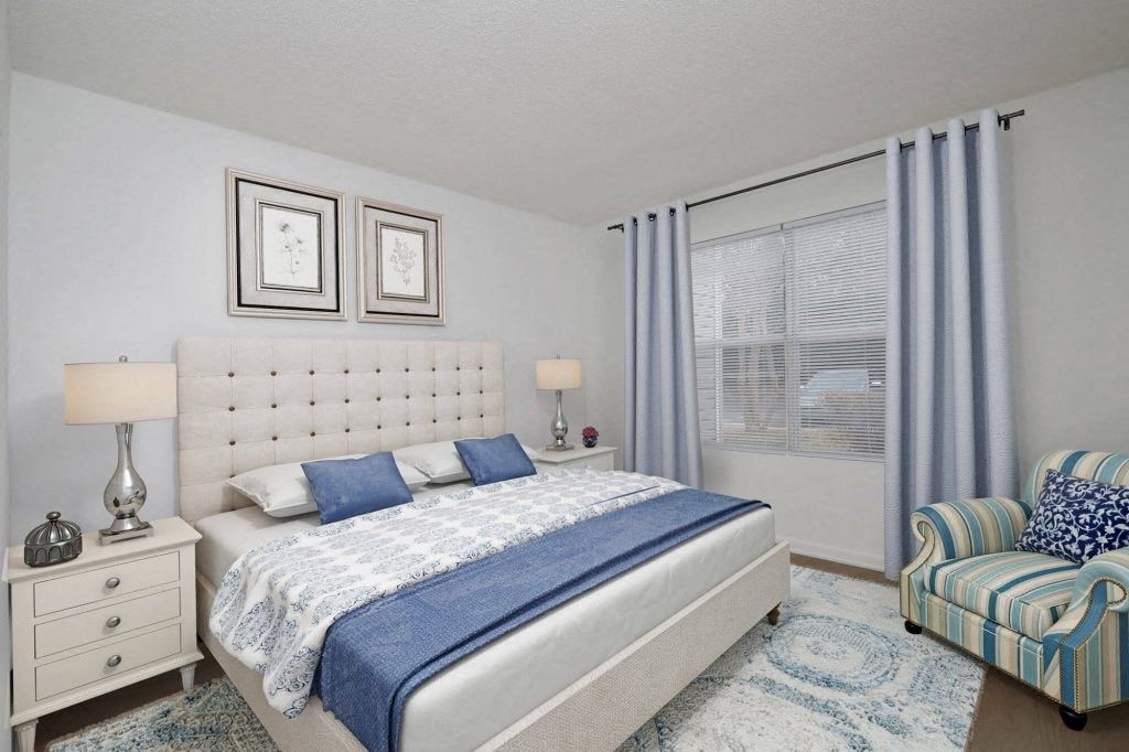 a bedroom with a bed and a window