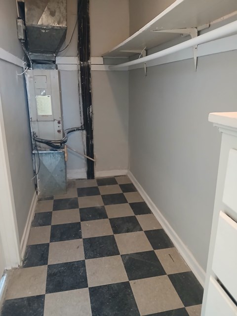 A black and white checkered floor in a small room.