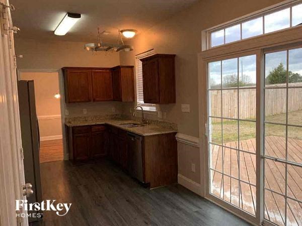 an empty kitchen with a large glass door