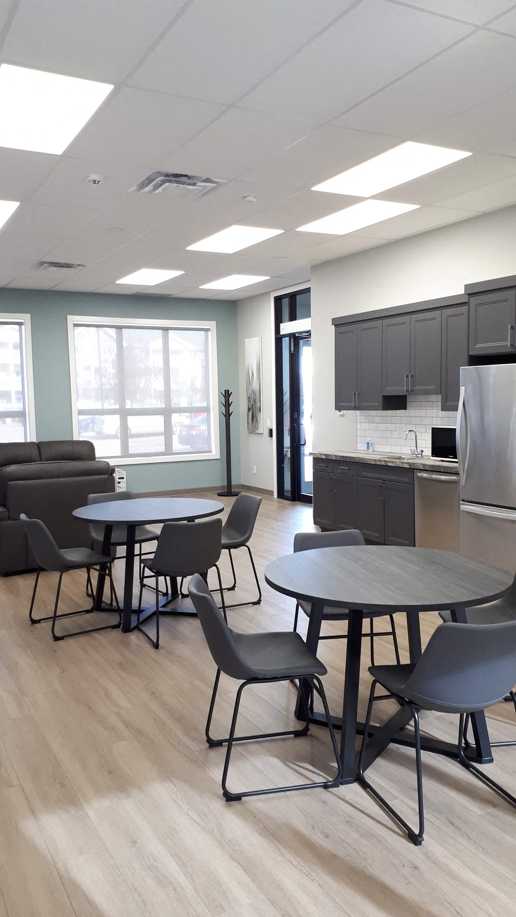 A room with a table and chairs in it.