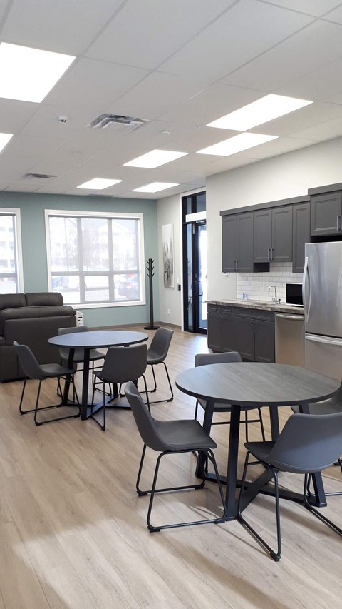 A room with a table and chairs in it.