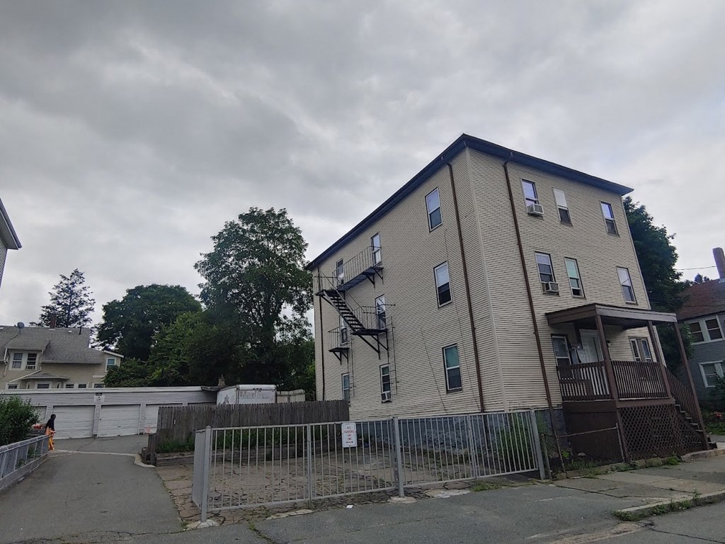 a building with a fence in front of it