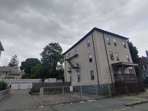a building with a fence in front of it