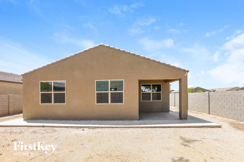 the front of a house with a garage and a blue sky