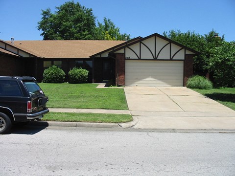 a house with a truck parked in front of it