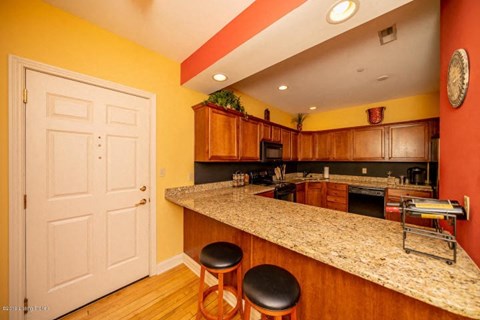 a kitchen with a counter top and a door