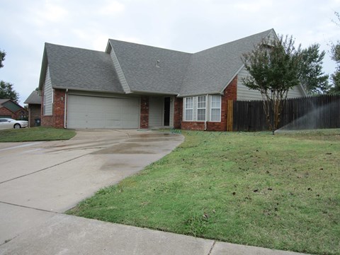 a house with a driveway in front of it