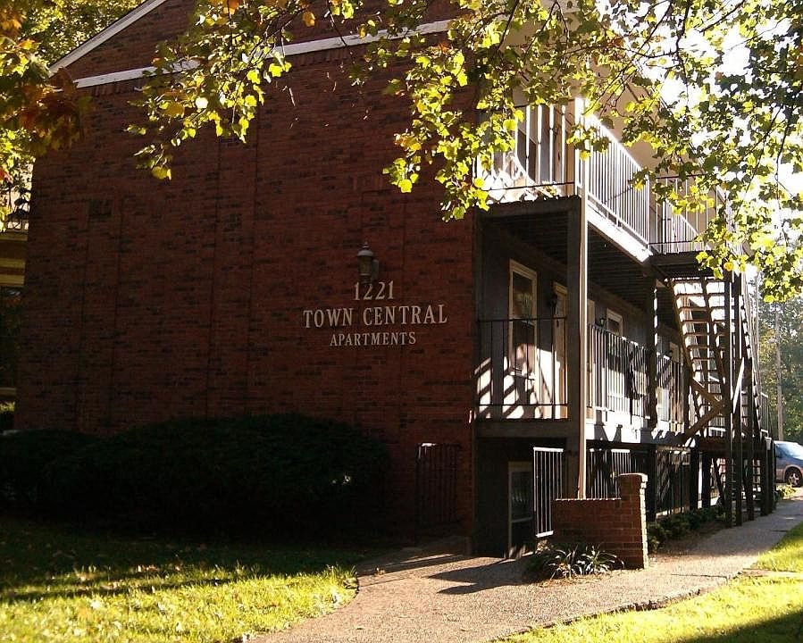 a red brick building with a sign on the side of it