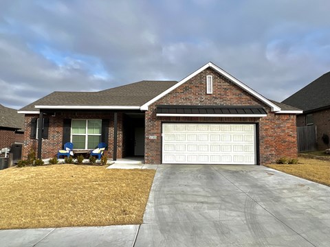 a house with a white garage door in front of it