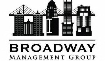 A black and white image of a city skyline with the words "Broadway Management Group" written below it.