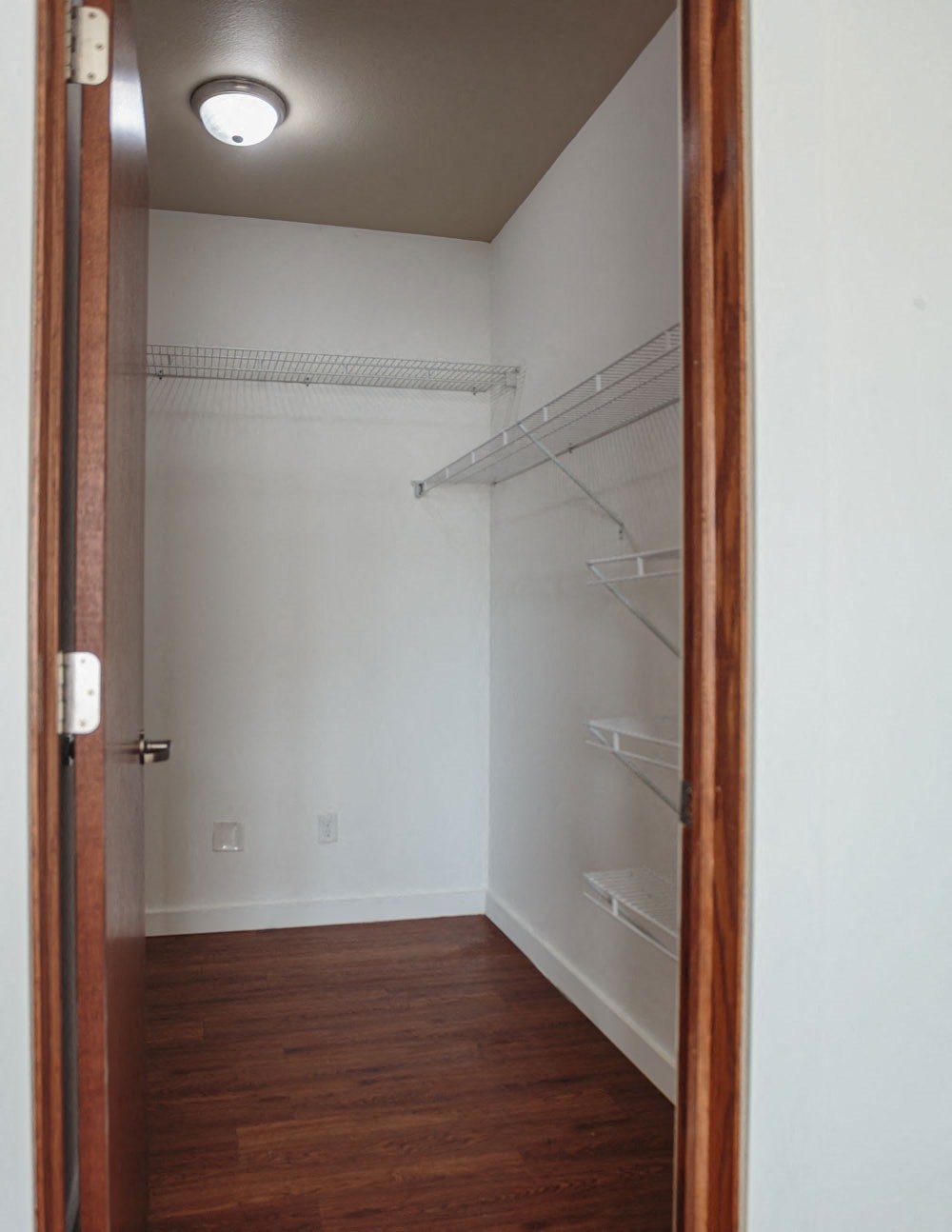 a room with a closet and a door open