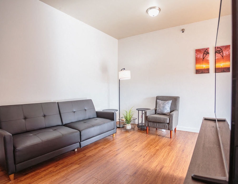 a living room with a couch and a chair