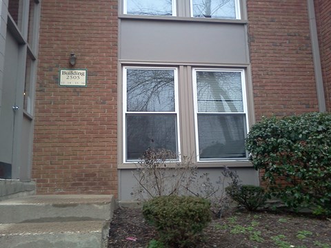 A building with a sign that says "Building 2505" on the brick wall.