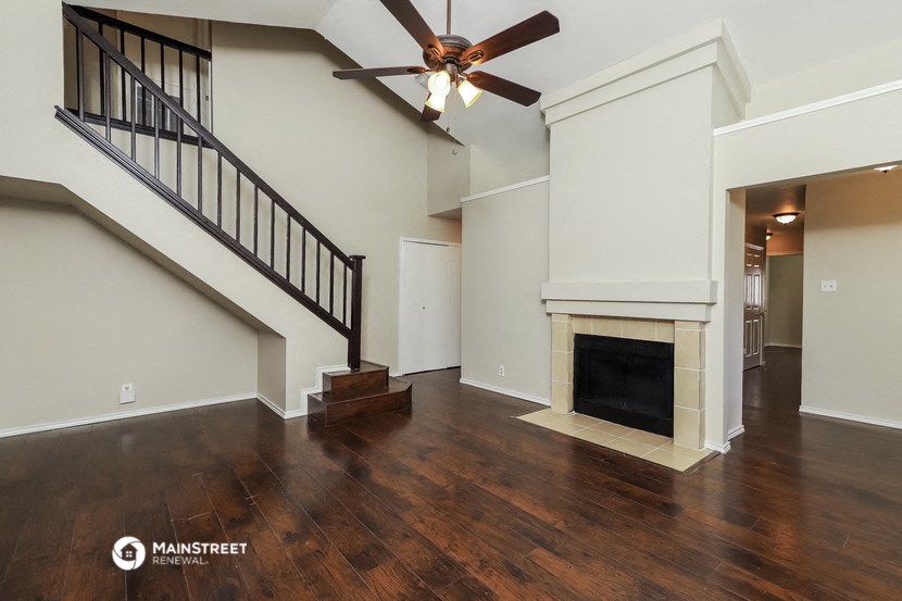 the family room has a fireplace and hardwood floors